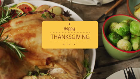 Animation-of-happy-thanksgiving-text-over-dinner-table-and-food