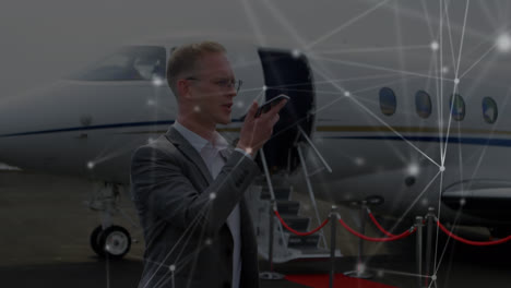 Animation-of-network-of-connections-over-caucasian-businessman-at-airport
