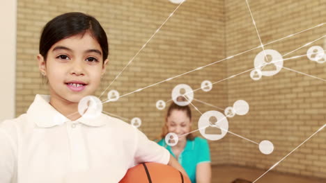 Animation-of-network-of-profile-icons-over-biracial-girl-with-basketball-showing-thumbs-up-at-school