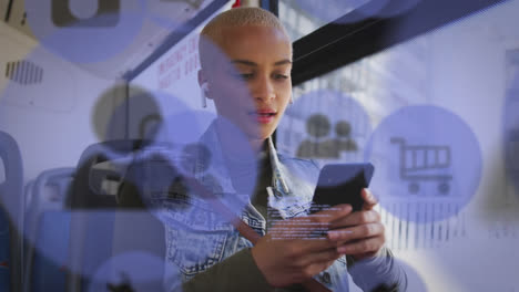 Animation-of-social-media-icons-and-data-processing-over-biracial-woman-in-bus-using-smartphone