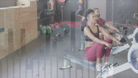 Animation-of-data-processing-on-graph-over-diverse-woman-and-men-training-on-rowing-machines-at-gym