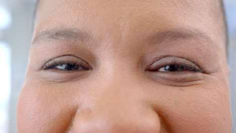 Portrait-of-happy-eyes-of-african-american-woman-in-hospital,-slow-motion