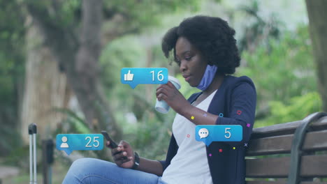 Animation-Von-Social-Media-Symbolen-Und-Daten-über-Einer-Afroamerikanischen-Frau,-Die-Ein-Smartphone-Verwendet