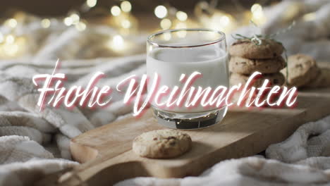 Frohe-weihnachten-text-in-white-over-christmas-cookies-and-milk-with-bokeh-lights