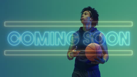 Animation-Des-„Coming-Soon“-Textes-In-Neon-über-Einem-Afroamerikanischen-Männlichen-Basketballspieler,-Der-Einen-Ball-Hält