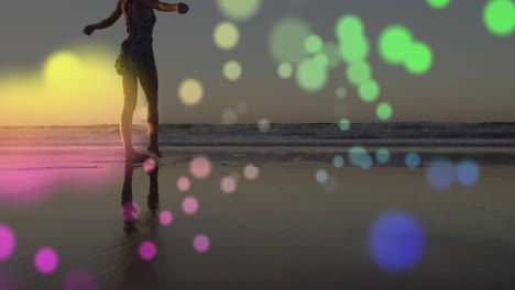 Animation-of-lights-over-happy-caucasian-woman-walking-on-beach