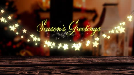 Animation-of-seasons-greetings-text-and-hanging-fairy-lights-against-decorated-christmas-house