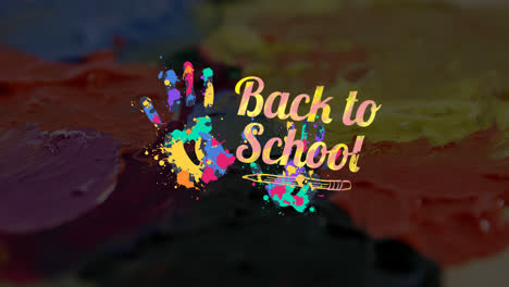 Animation-of-back-to-school-text-over-multi-coloured-hand-prints