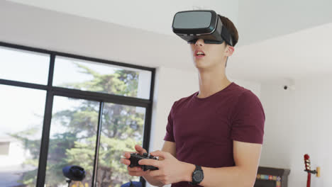 Asian-boy-wearing-vr-headset-playing-video-games-at-home