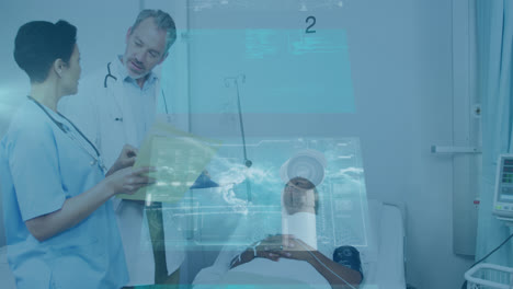 Animation-of-data-on-digital-screens-over-diverse-female-and-male-doctors-and-male-patient-on-bed