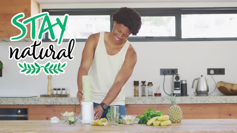 Animation-of-vegan-food-text-over-african-american-man-making-vegetable-smoothie