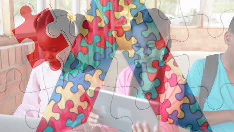 Animation-of-puzzle-pieces-ribbon-and-diverse-schoolchildren