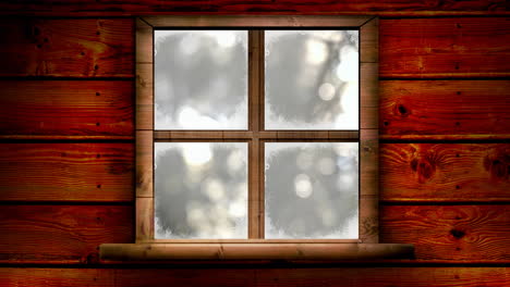 Animation-of-window-over-blurred-winter-landscape-at-christmas