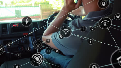 Animation-of-network-of-connections-with-icons-over-caucasian-man-using-smartphone-in-car