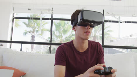 Asian-boy-wearing-vr-headset-playing-video-games-at-home