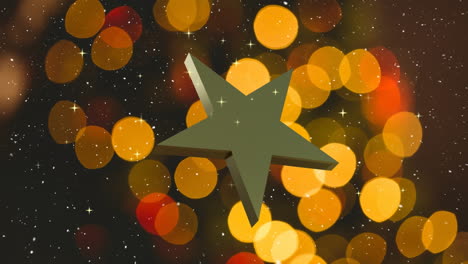 Rotating-gold-christmas-star-over-falling-snow-with-orange-and-red-bokeh-lights-on-dark-background