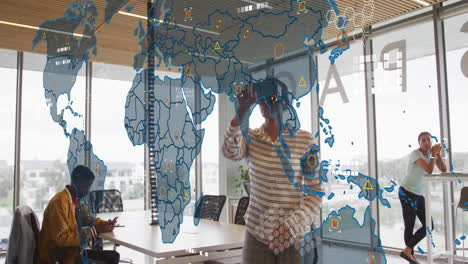 Animation-of-world-map-against-african-american-woman-wearing-vr-headset-at-office