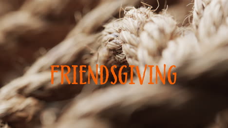 Animation-of-friendsgiving-text-over-ropes-on-brown-background