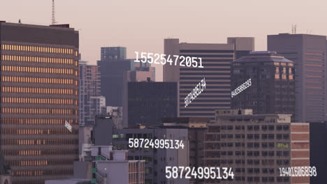 Animation-of-changing-numbers-and-data-processing-against-aerial-view-of-tall-buildings