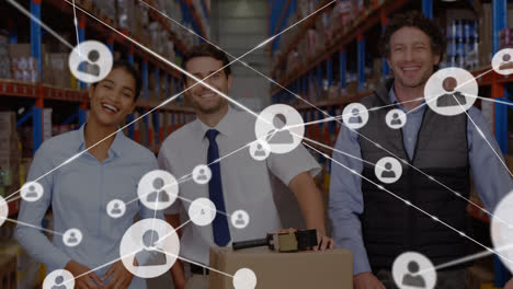 Animation-of-network-of-connections-with-icons-over-diverse-business-people-working-in-warehouse