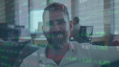 Animation-of-stock-market-data-processing-and-sqaure-shapes-over-caucasian-man-smiling-at-office