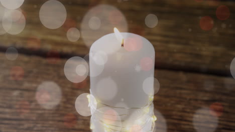 Animation-of-light-spots-over-candle-at-christmas
