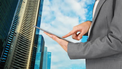 Composite-view-of-mid-section-of-businesswoman-using-digital-tablet-against-tall-buildings