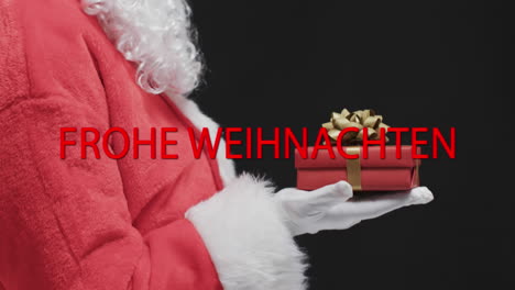 Frohe-Weihnachten-Text-In-Red-Over-Father-Christmas-Holding-Gift-On-Black-Background
