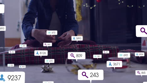 Animation-of-social-media-icons-with-numbers-over-caucasian-woman-packing-presents