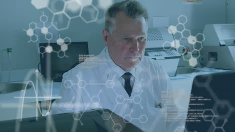 Animation-of-medical-data-processing-over-caucasian-male-scientist-using-a-computer-at-laboratory