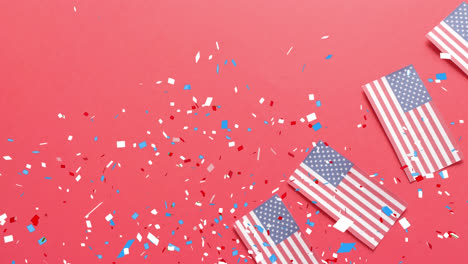 Animation-Von-Konfetti,-Das-über-Die-Flaggen-Der-Vereinigten-Staaten-Von-Amerika-Auf-Rotem-Hintergrund-Fällt