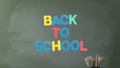 Animation-of-back-to-school-text-over-pencils-on-grey-background