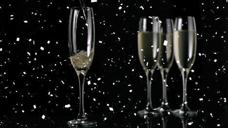 Animation-of-falling-confetti-over-champagne-getting-poured-in-flute-glass-against-black-background