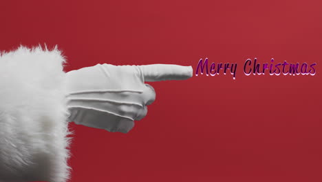 Hand-of-santa-claus-pointin-to-merry-christmas-text-in-pink-on-red-background
