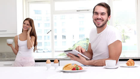 Attractive-couple-having-breakfast-together