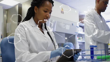 Animation-of-medical-data-processing-on-african-american-female-scientist-using-tablet-at-laboratory