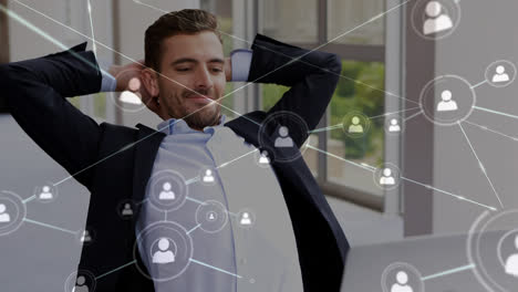 Animation-of-profile-connecting-with-lines-over-caucasian-happy-man-with-hands-behind-head-in-office