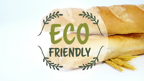 Animation-of-eco-friendly-text-banner-against-close-up-of-fresh-bread-and-wheat-ears