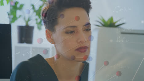 Dna-structure-and-changing-numbers-over-biracial-woman-using-computer-at-office