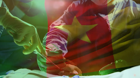 Animation-of-waving-senegal-flag-over-team-of-diverse-surgeons-performing-operation-at-hospital