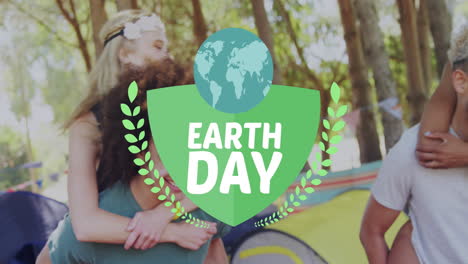Animation-of-globe-with-earth-day-text-over-diverse-friends-in-forest