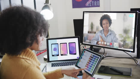 African-american-businesswoman-on-video-call-with-african-american-female-colleague-on-screen