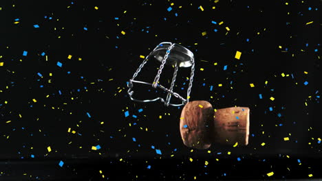 Animation-of-confetti-falling-over-champagne-cork-on-black-background
