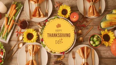Animation-of-happy-thanksgiving-day-text-and-dinner-on-table-background