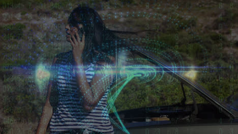 Animation-of-pattern-spinning-with-data-over-biracial-woman-talking-on-phone-by-broken-down-car