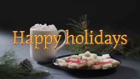Happy-holidays-text-in-orange-over-christmas-hot-chocolate-and-cookies