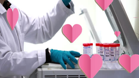 Animation-of-falling-hearts-over-scientist-in-laboratory