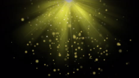 Animation-of-yellow-spots-and-bright-light-spot-against-black-background-with-copy-space