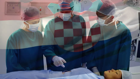 Animación-De-La-Bandera-De-Croacia-Contra-Un-Equipo-De-Diversos-Cirujanos-Discutiendo-Antes-De-La-Operación-En-El-Hospital