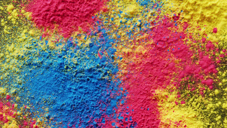 Video-of-close-up-of-multi-coloured-powders-with-copy-space-on-black-background